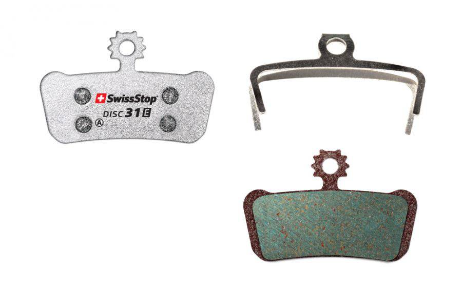 SwissStop Disc 31 Organic brake pads for SRAM MTB G2, Guide, Level Silver disc brakes on e-bike, shown mounted on the rotor.