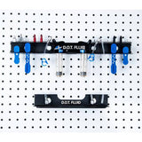 Park Tool JH-4 wall-mounted bleed kit organizer for hydraulic brake accessories in a workshop setting, with tools and accessories visible.