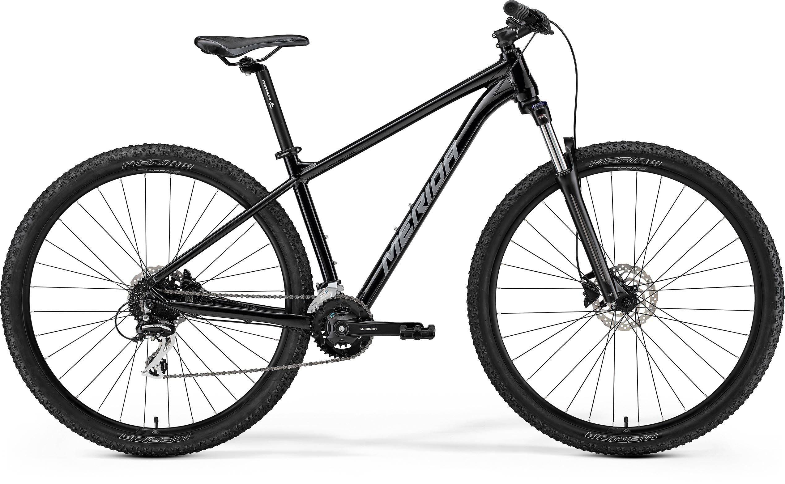 Merida Big Nine 20 SE aluminum hardtail mountain bike with Shimano Acera components, black frame and knobby tires.