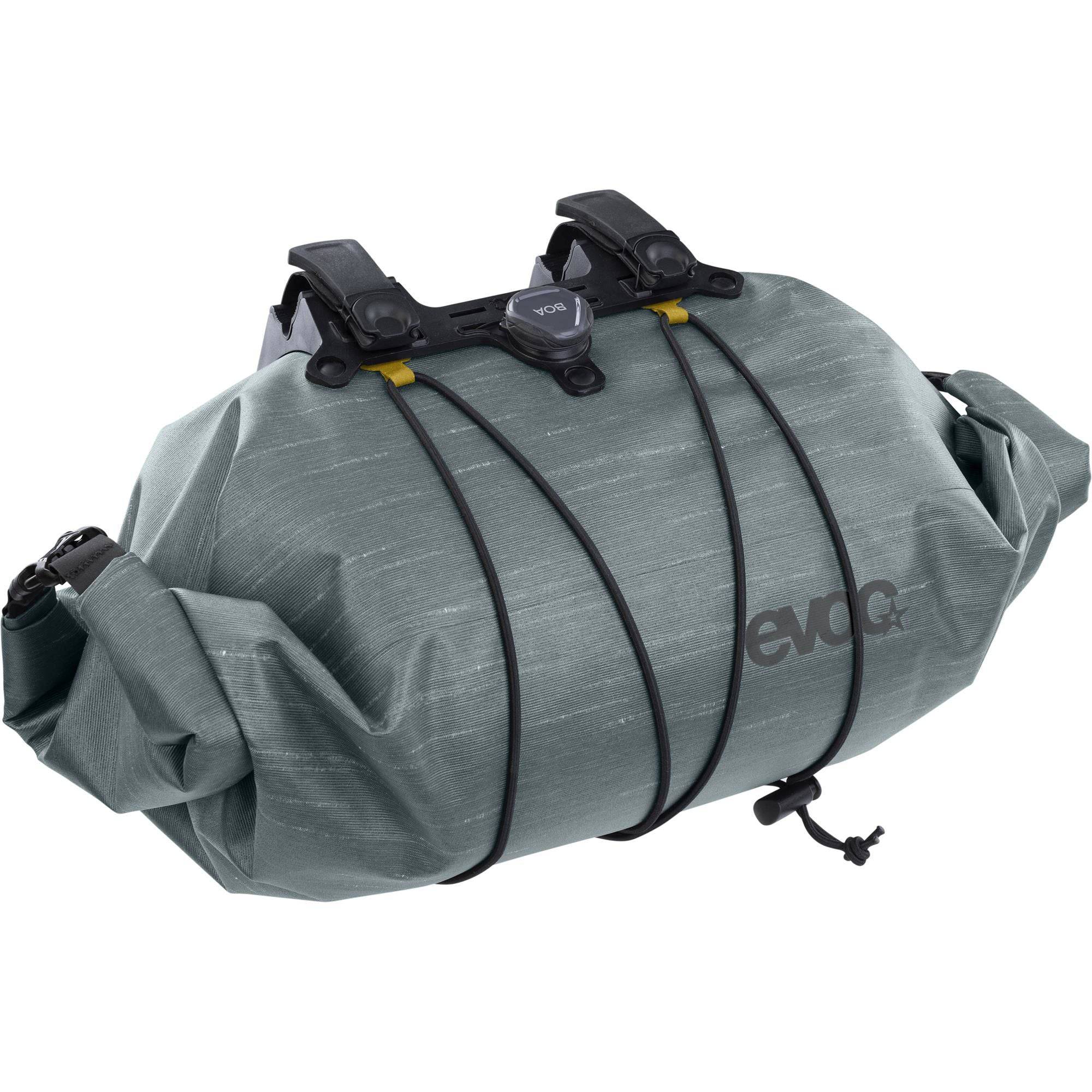 EVOC waterproof handlebar bag with Boa closure, 9L cycling storage accessory mounted on a bike handlebar
