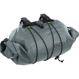 EVOC waterproof handlebar bag with Boa closure, 9L cycling storage accessory mounted on a bike handlebar