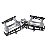 Genetic Track Pro SB flat bicycle pedals with sealed bearings and 9/16-inch spindle, designed for MTB and BMX riding.