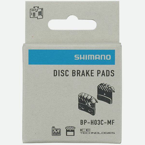 Shimano H03C-MF metal sintered disc brake pads with spring and cooling fins for 4-piston mountain bike brakes.