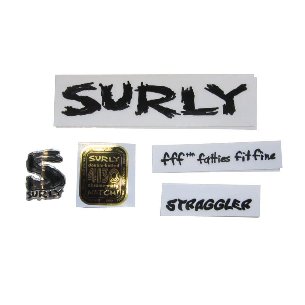 Surly Cross Check dropout screws and headbadge for bike frame repair and replacement, showing metal components and branding.
