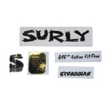 Surly Cross Check dropout screws and headbadge for bike frame repair and replacement, showing metal components and branding.