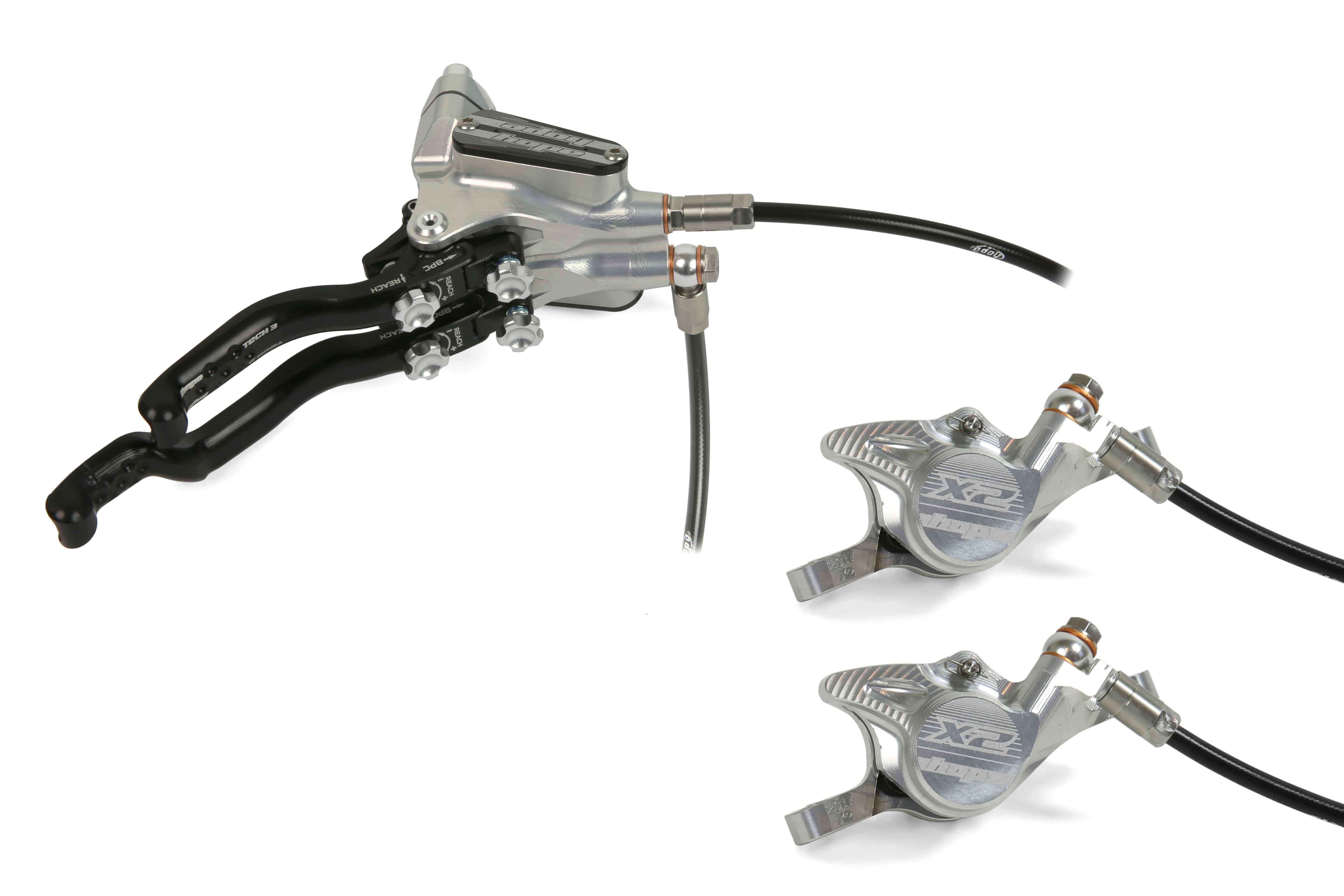 Hope Tech 3 X2 Duo MTB hydraulic brake system with dual circuits and adjustable levers, mounted on mountain bike components.