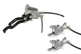 Hope Tech 3 X2 Duo MTB hydraulic brake system with dual circuits and adjustable levers, mounted on mountain bike components.