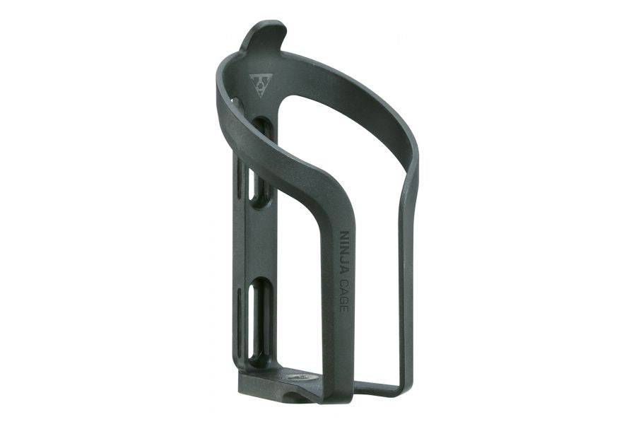 Topeak Ninja Cage black water bottle holder mounted on a cycling bike frame, designed for secure hydration during rides.
