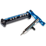 Park Tool QTH-1 quick change bit driver set with magnetic 1/4-inch bits for bike repair, shown with various bits in a workshop setting.