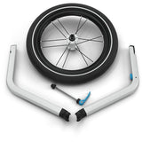 Thule jogging kit for Chariot Cross 2 stroller with front wheel attachment for running or jogging outdoors.