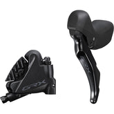 Shimano GRX ST-RX400 hydraulic STI shifter and BR-RX410 flat mount rear brake caliper for gravel bikes, black components.