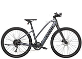 Trek Dual Sport+ 2 Stagger women’s e-hybrid bike with Shimano Altus M2000 gears and HyDrive motor, black and silver design.