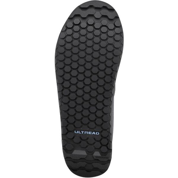 Shimano GF4W women's gravel cycling shoes with flat pedals and ULTREAD grip for secure riding on rugged terrain.