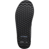 Shimano GF4W women's gravel cycling shoes with flat pedals and ULTREAD grip for secure riding on rugged terrain.
