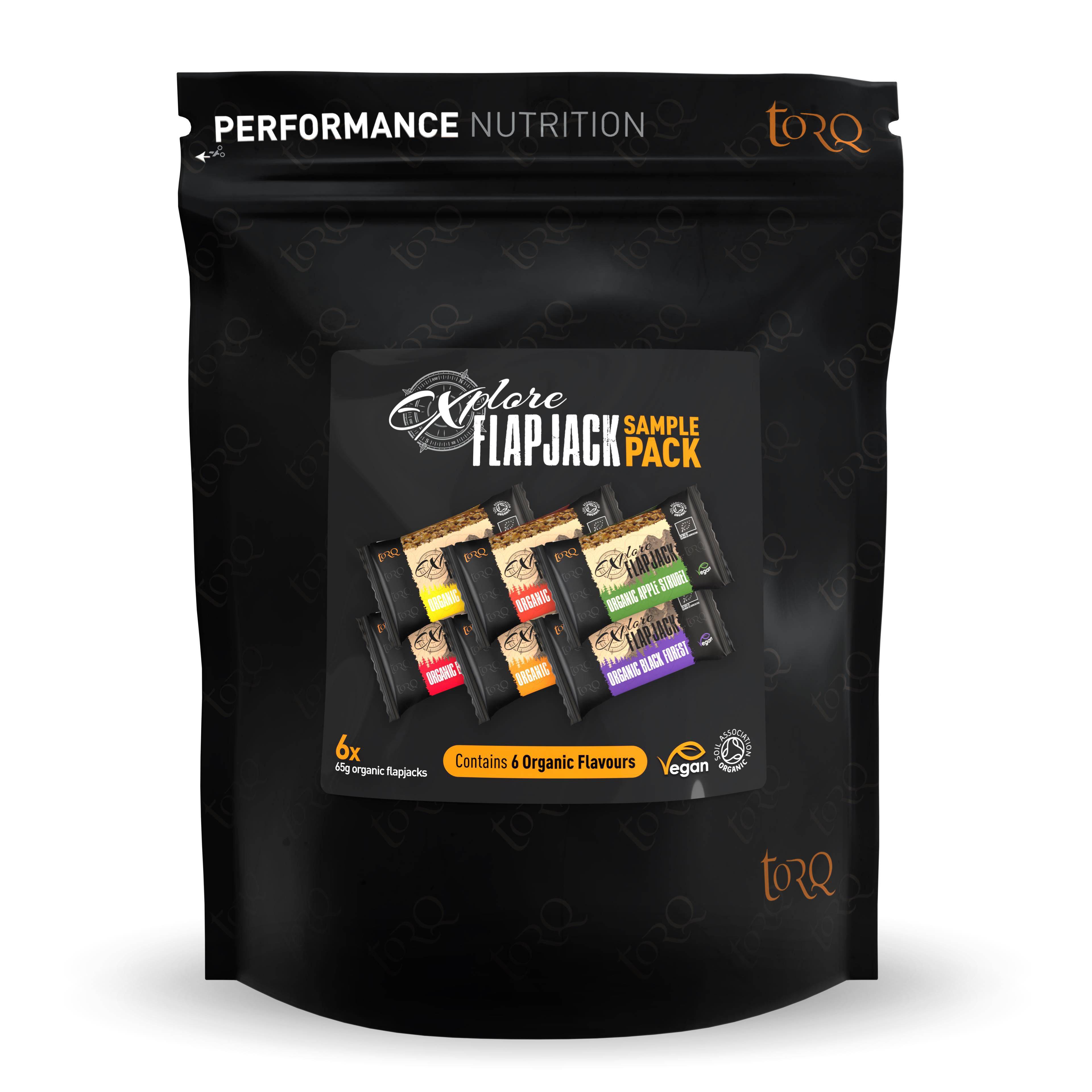 Assorted TORQ Organic Vegan Energy Bars Flapjack Sampler Pack featuring six different flavors, displayed in an organized box.