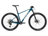Giant XTC SLR 29 1 mountain bike with Shimano Deore XT M8100 disc brakes, featuring a lightweight frame and knobby tires.