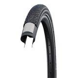 Schwalbe Road Cruiser Plus bicycle tyre showing tread pattern and sidewall with branding for durable puncture protection and eco-friendly compound.