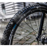 Schwalbe Johnny Watts 365 DD Greenguard puncture protection tire for durable bike components, shown in close-up view.