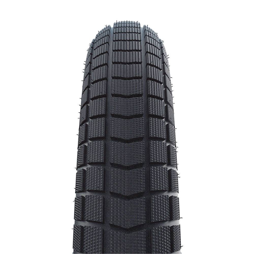 Schwalbe Super Moto-X E-Bike tyre with green puncture protection and 3mm Green Guard layer, shown mounted on a wheel.