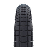 Schwalbe Super Moto-X E-Bike tyre with green puncture protection and 3mm Green Guard layer, shown mounted on a wheel.