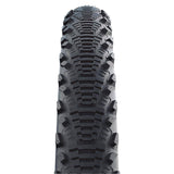 Schwalbe Cx Comp tyre with K-Guard puncture protection and LiteSkin sidewalls, showcasing the durable bicycle tyre design.