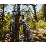 Schwalbe Smart Sam K-Guard mountain bike tyre with versatile tread and puncture protection, shown mounted on a bicycle wheel.