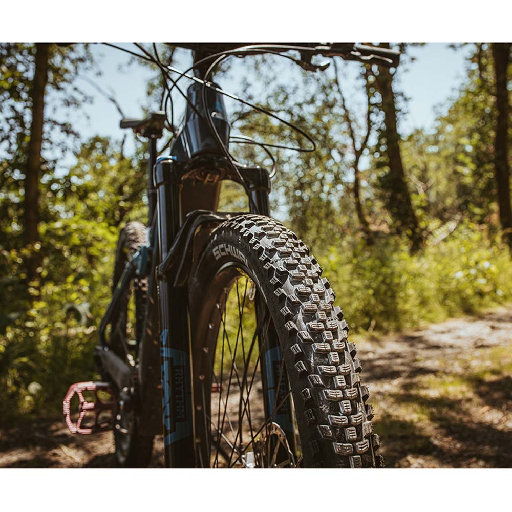 Schwalbe Smart Sam K-Guard mountain bike tyre with versatile tread and puncture protection, shown mounted on a bike wheel.