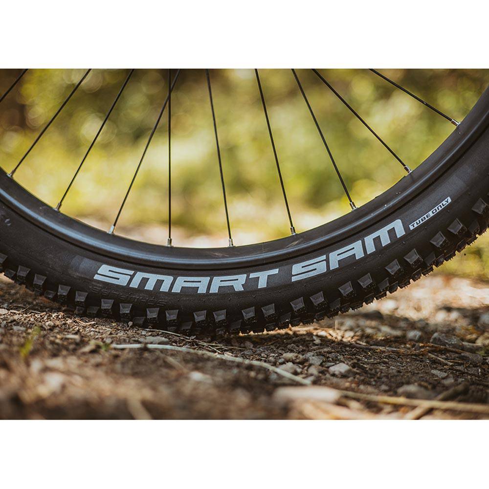 Schwalbe Smart Sam K-Guard mountain bike tyre with versatile tread and puncture protection, shown mounted on a bike wheel.