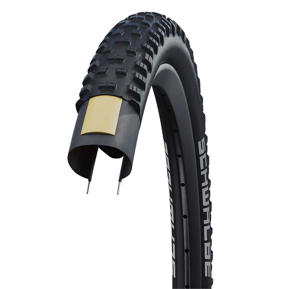 Schwalbe Tough Tom MTB tyre with K-Guard puncture protection, designed for trail riding, showing the tyre's tread pattern and sidewall.