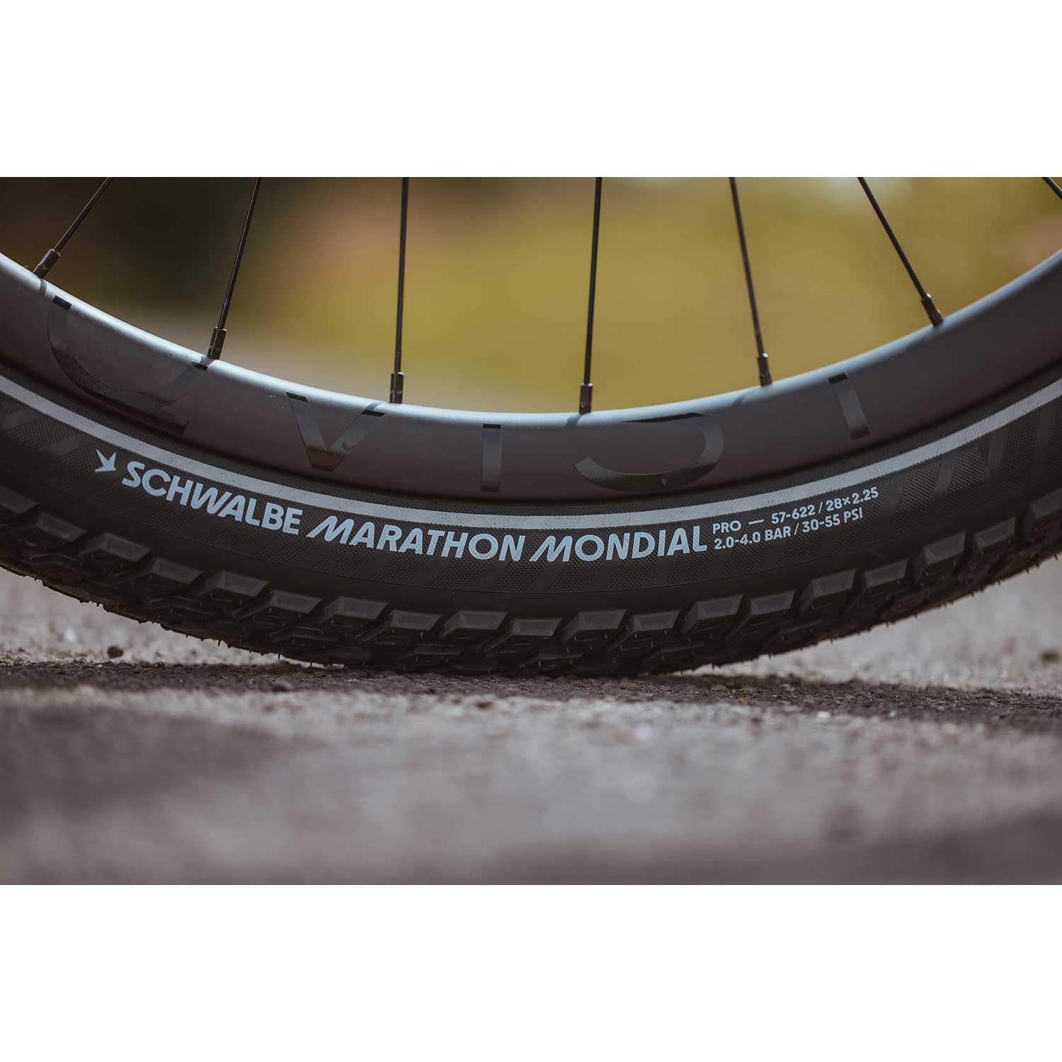Schwalbe Marathon Mondial Raceguard touring tyre with puncture protection and e-bike readiness, shown mounted on a bicycle wheel.