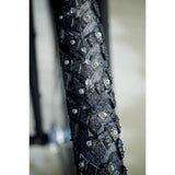 Schwalbe Marathon Winter Raceguard tyre with 168 spikes for icy roads, showing the tyre's tread and spike design for winter cycling.