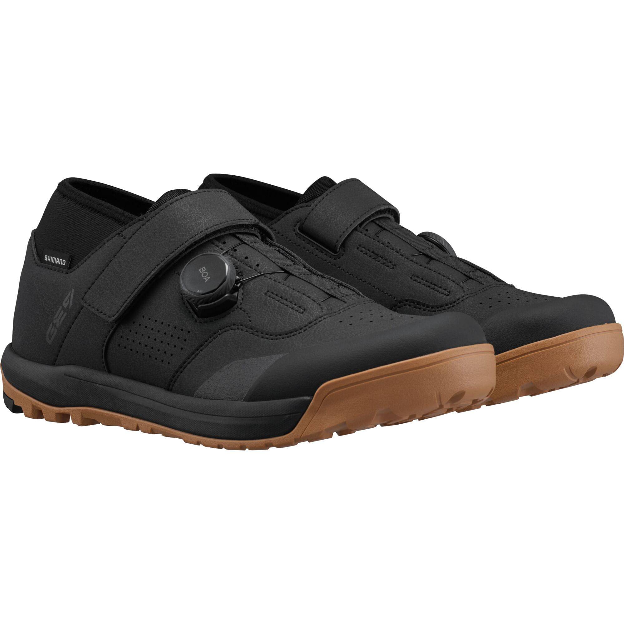 Shimano GE9 mountain bike shoes with BOA Fit System and SPD cleats, black and gray design, close-up view.