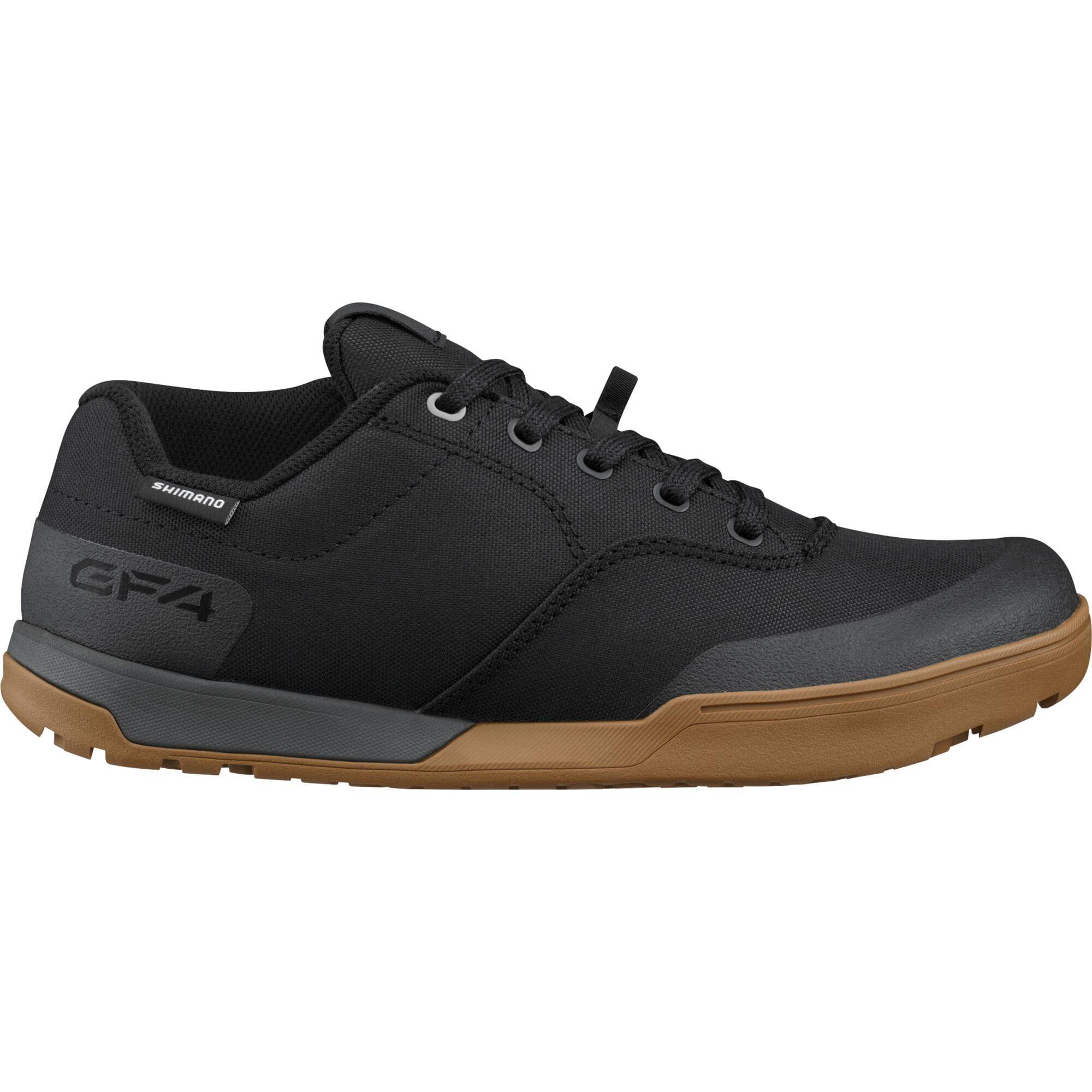 Shimano GF4W women's gravel and flat-pedal cycling shoes with ULTREAD® grip, shown in black with textured sole and secure straps.