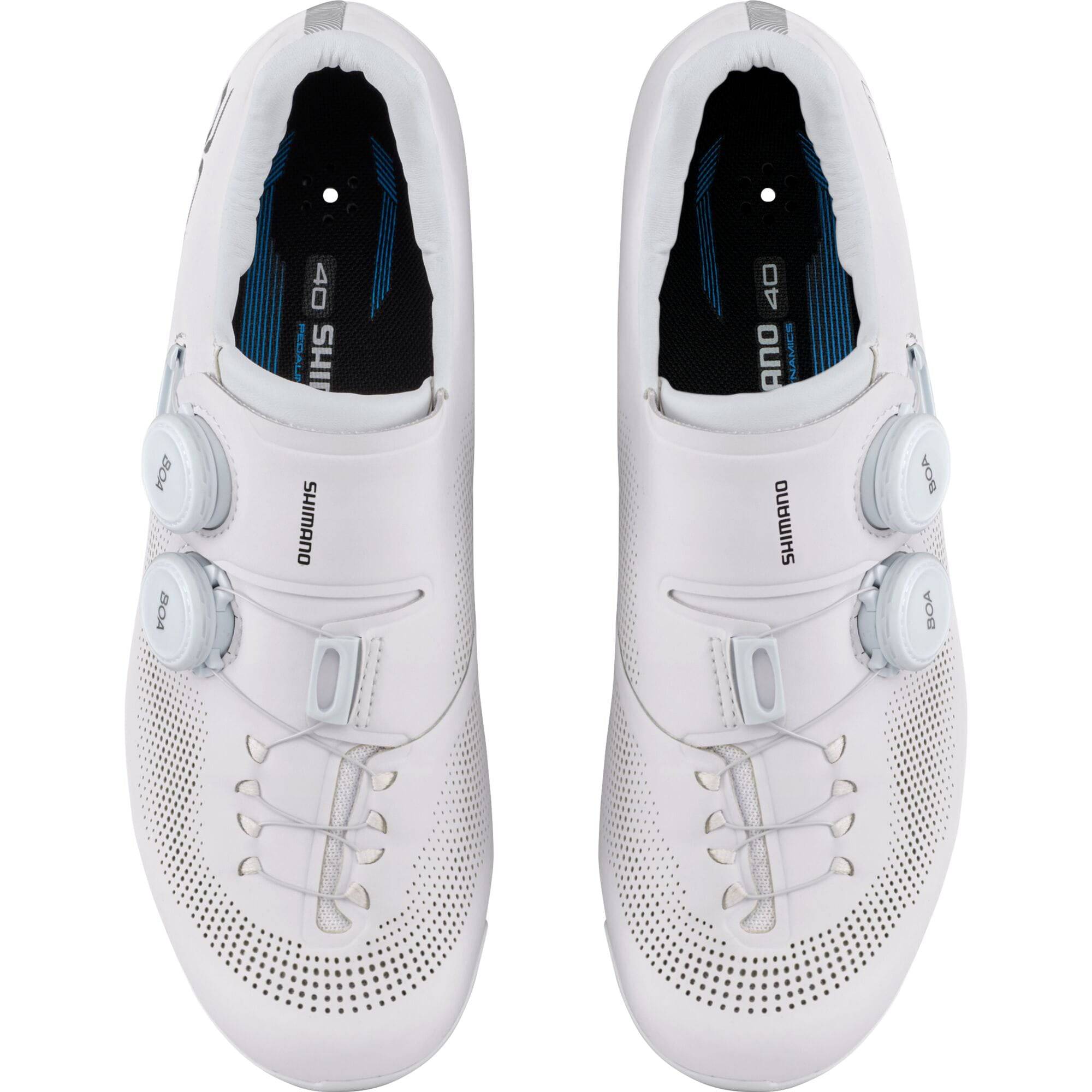 Shimano RC7W women's road cycling shoes with BOA fit system and carbon midsole, shown from the side with adjustable straps.