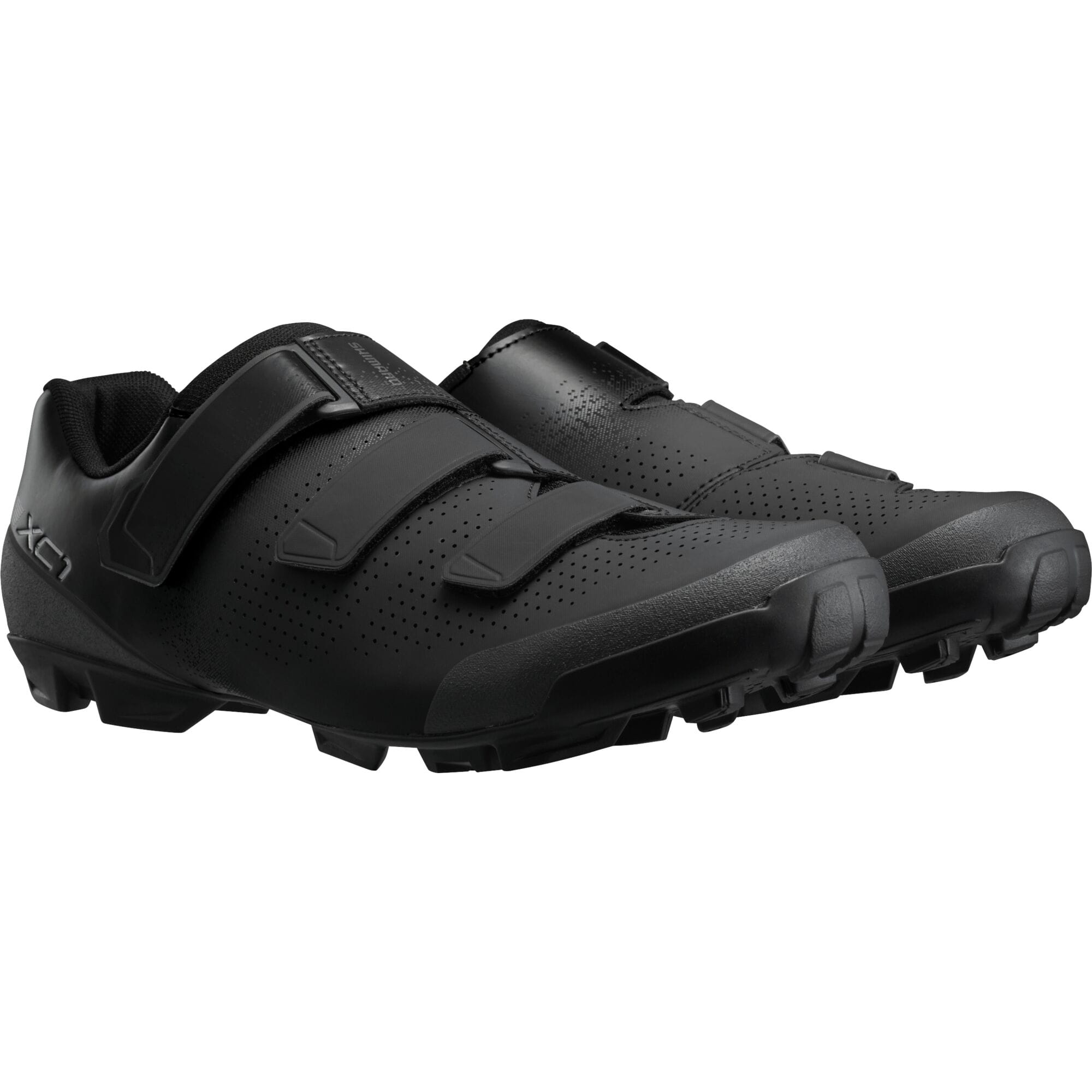 Shimano XC1 mountain bike shoes with SPD cleats, featuring grip soles and comfort fit, designed for cycling enthusiasts.