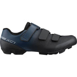 Shimano XC1W women's mountain bike shoes with SPD compatibility and hook-and-loop straps, shown in black with textured soles.