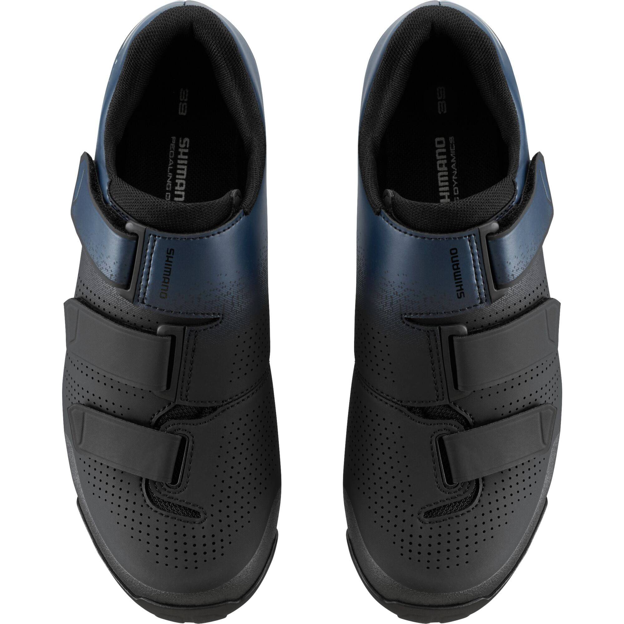 Shimano XC1W women's mountain bike shoes with SPD compatibility and hook-and-loop straps, shown in black and white design.