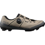 Shimano XC5 mountain bike shoes with BOA Fit System and carbon fiber midsole, shown from the front on a white background.
