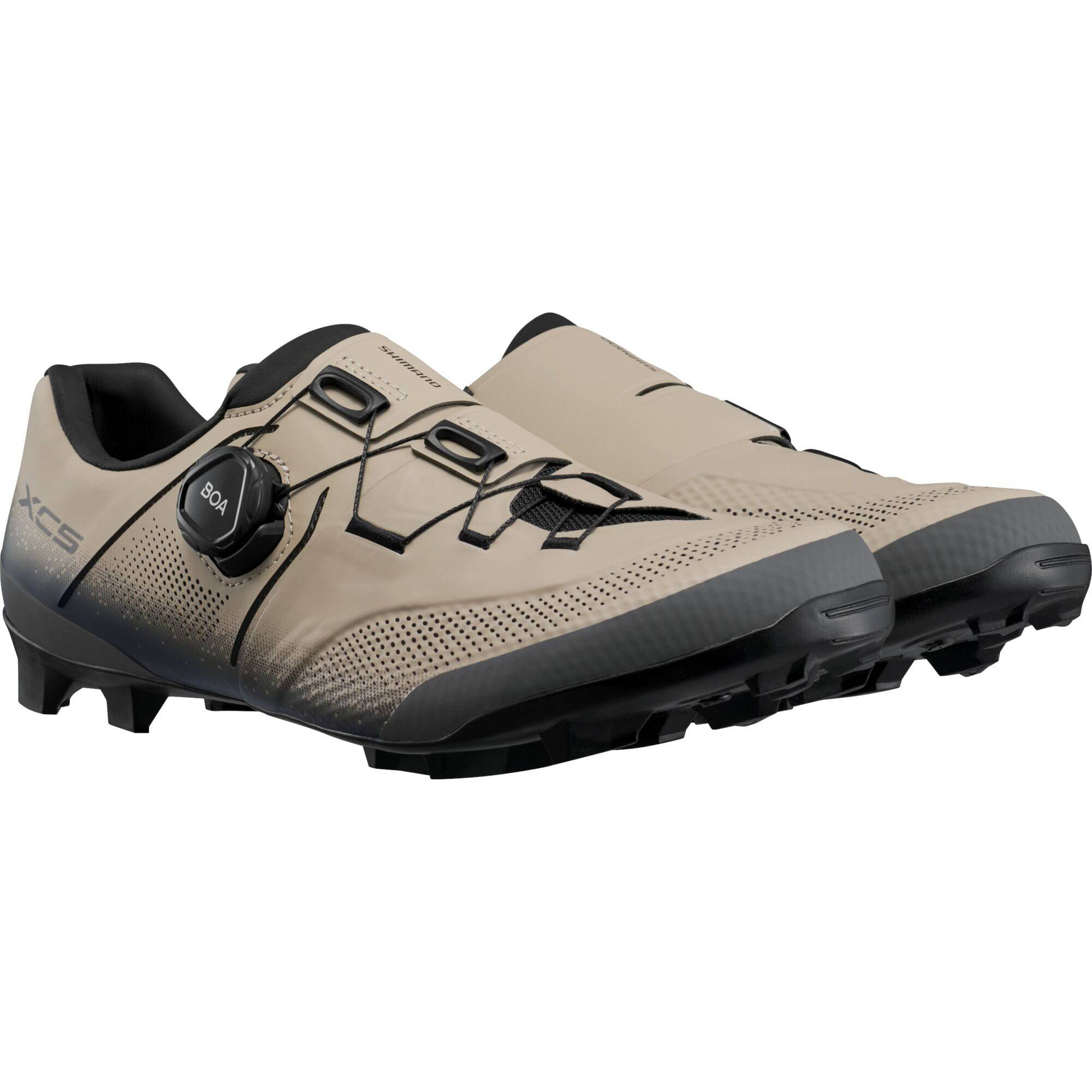 Shimano XC5 mountain bike shoes with BOA Fit System and carbon fiber midsole, showing the sleek design and sturdy construction.