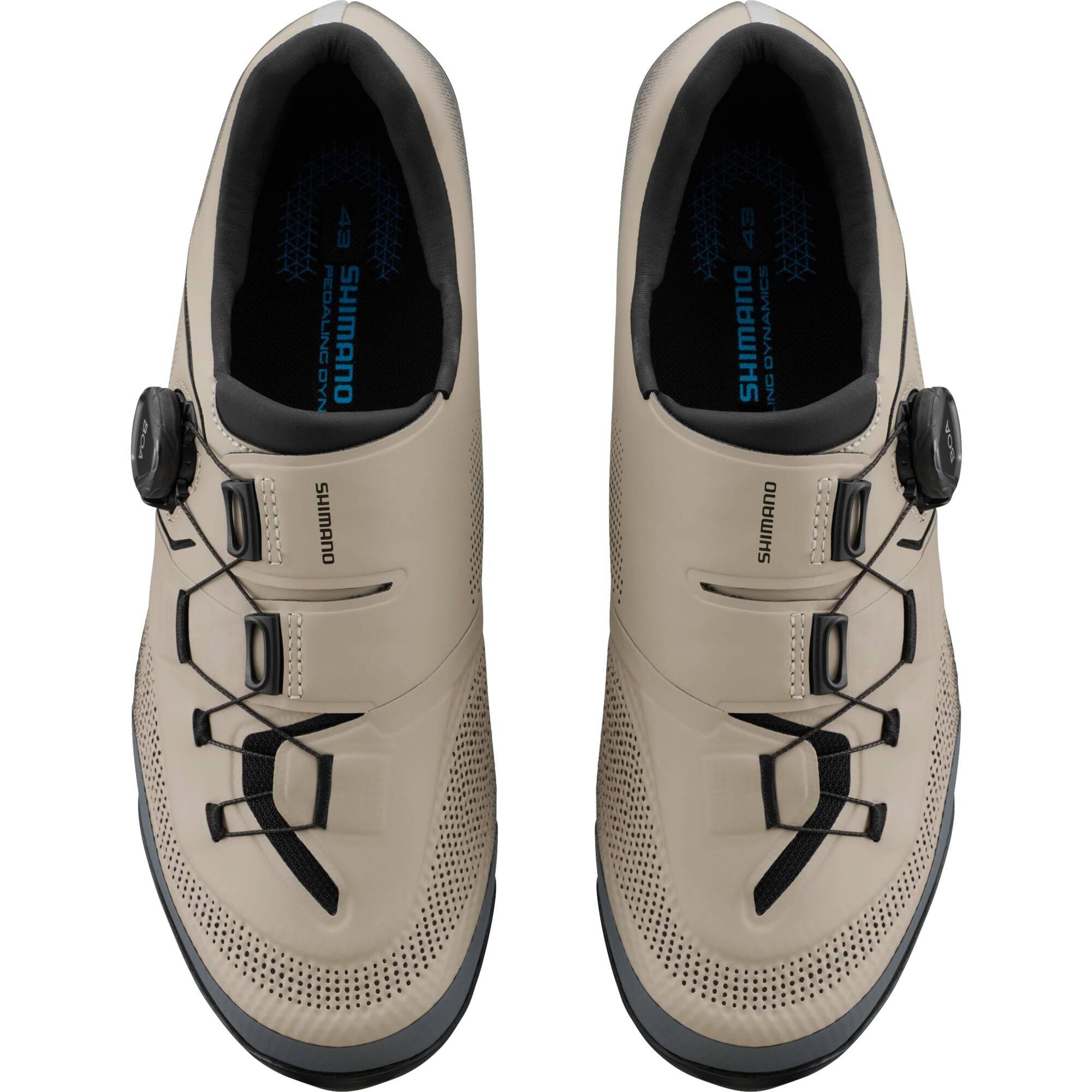 Shimano XC5 mountain bike shoes with BOA fit system and carbon fiber midsole, black and gray, shown from side angle.