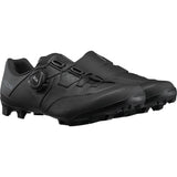 Shimano XC5W women's MTB cycling shoes with BOA Fit System, designed for off-road mountain biking, shown in a stylish black and white design.
