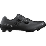 Shimano XC7 mountain bike shoes with BOA Fit System and SPD compatibility, shown in black and white with secure closures.