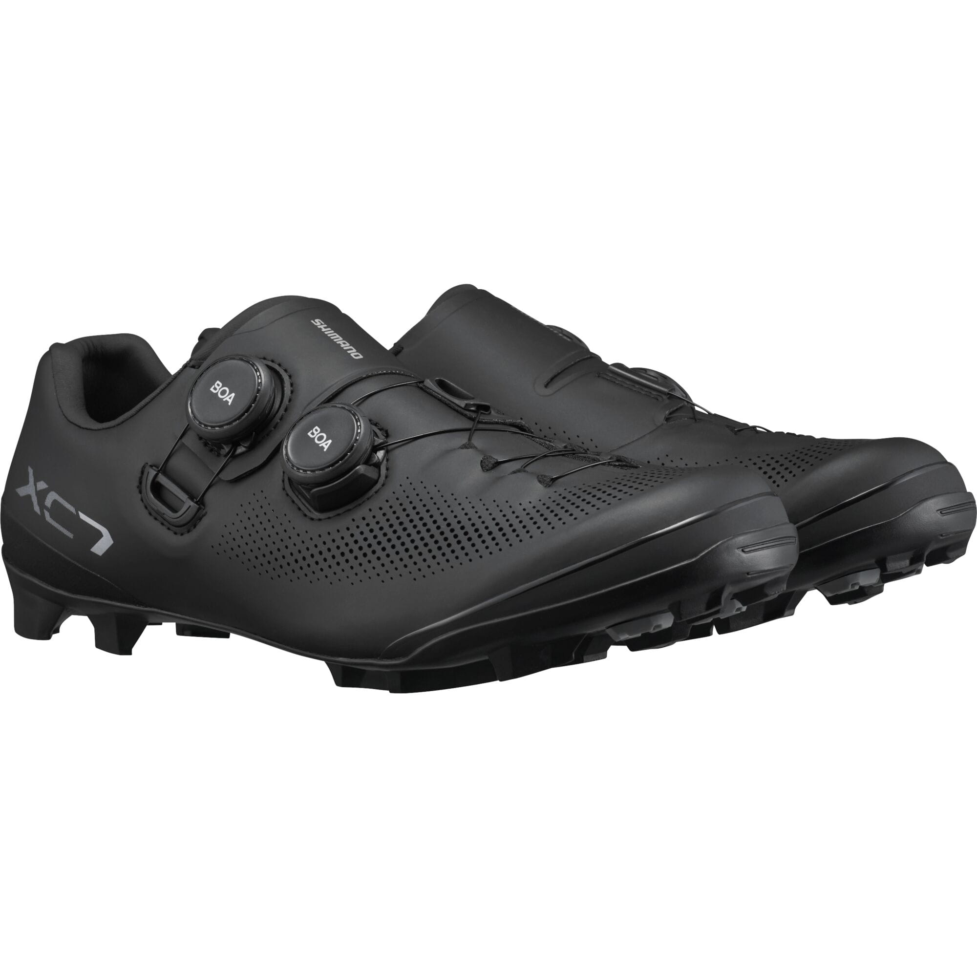 Shimano XC7 mountain bike shoes with BOA Fit System and SPD compatibility, showcasing a black and white design with secure closure.