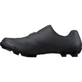 Shimano XC7 mountain bike shoes with BOA Fit System and SPD compatibility, showing black shoes with branding and closure system.