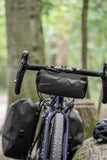 Madison Bags Roam waterproof handlebar bag with elastic strap mount and reflective trim, designed for cycling accessories.