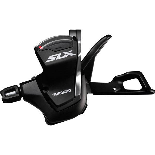Shimano SLX SL-M7000 11-speed MTB Rapidfire shift levers mounted on handlebar for precise gear shifting.