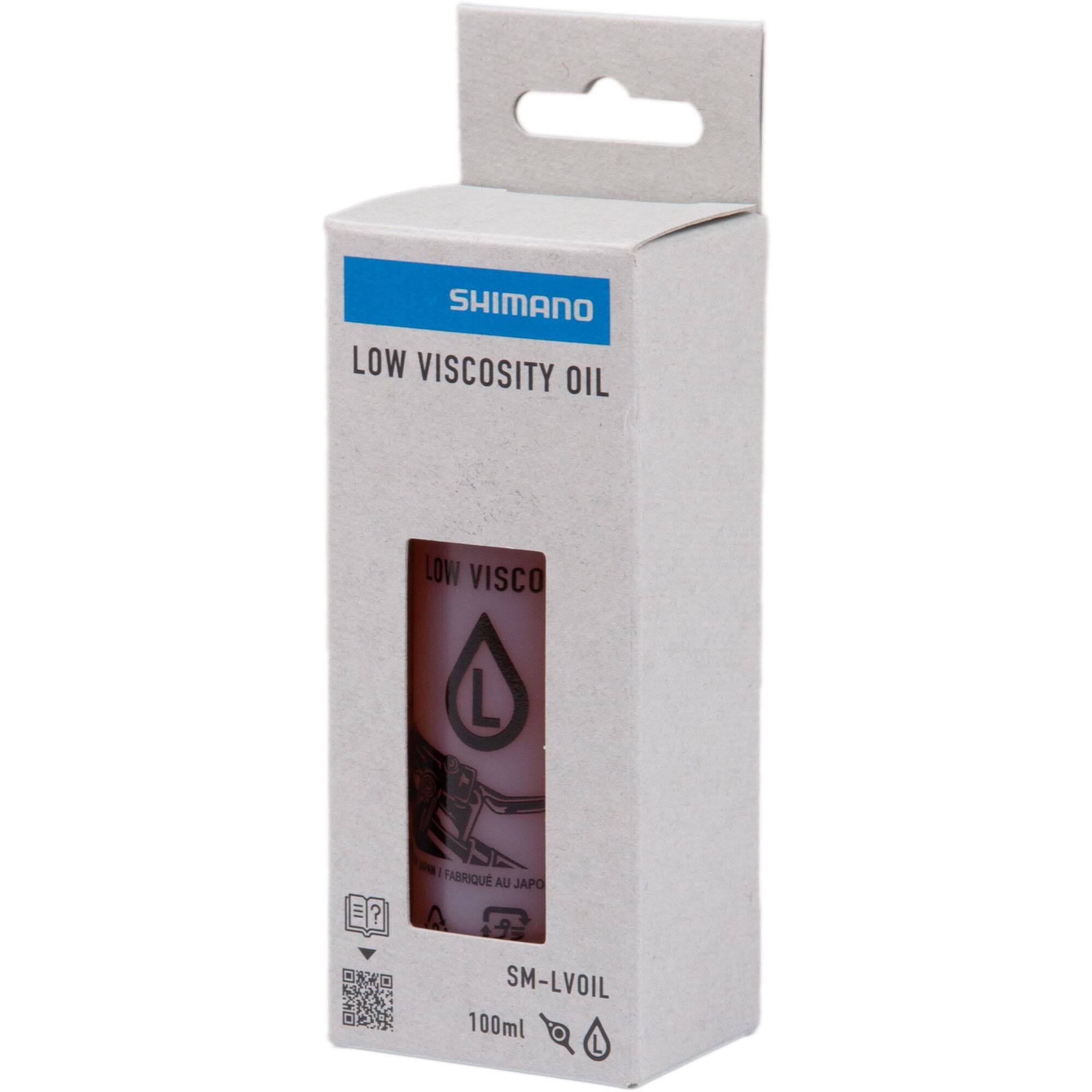 Shimano SM-LVOIL low viscosity mineral oil 100ml for XTR M9200 and XT M8200 brake components, shown in a clear bottle.