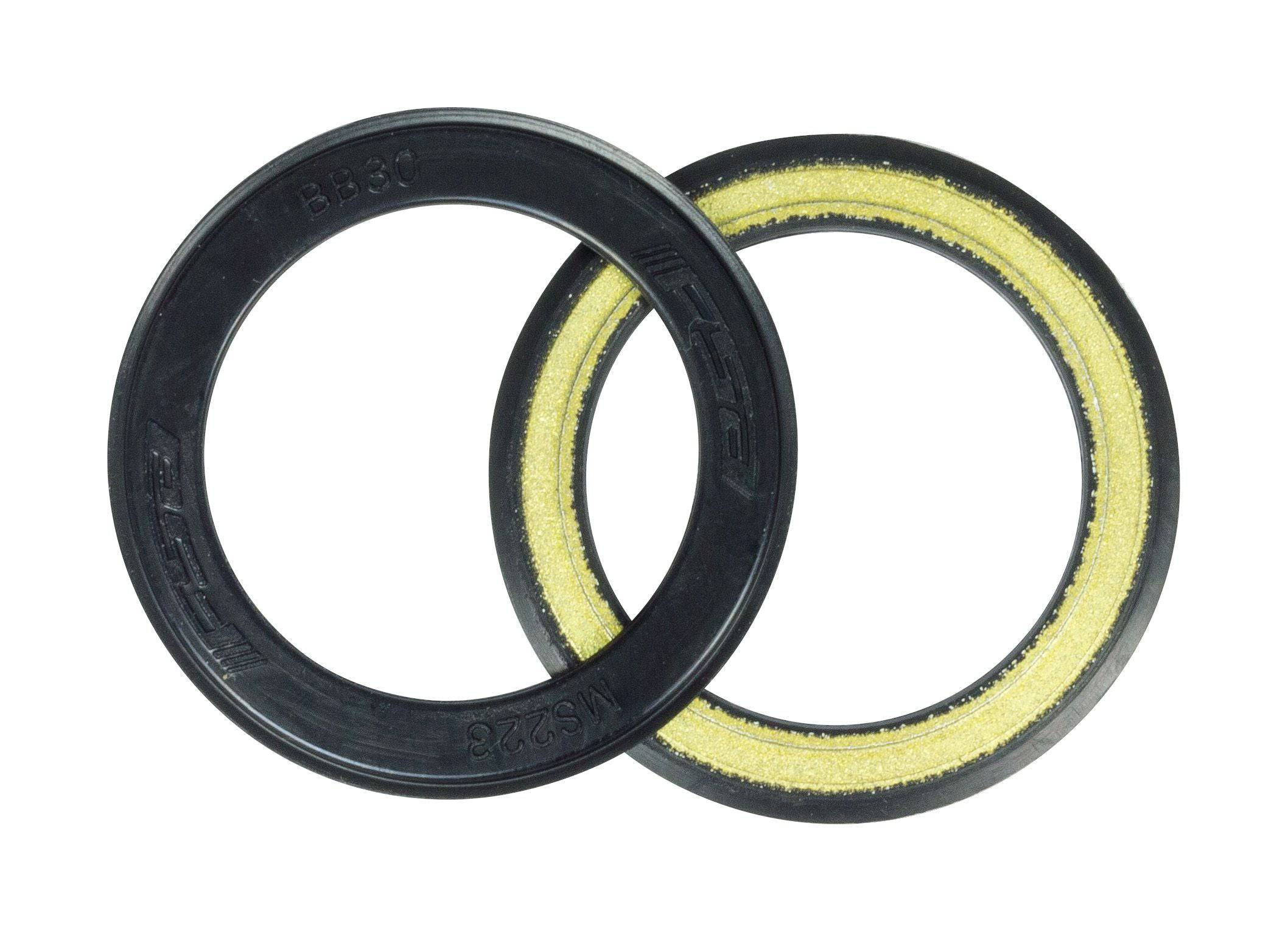 Pair of FSA BB30 bearing covers in black for bottom bracket protection, designed for FSA bike components.