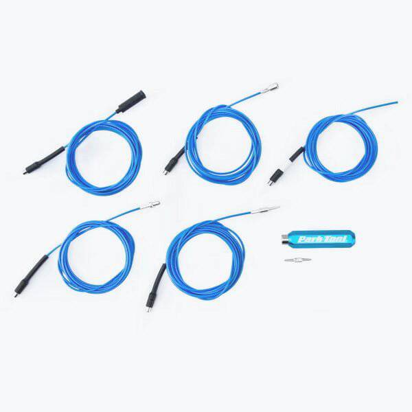 Park Tool IR-1.3 internal cable routing kit for carbon, titanium, and aluminum bike frames, shown in workshop setting.