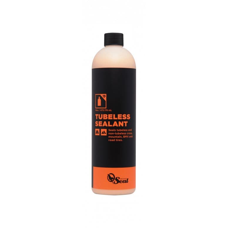 Orange Seal tubeless sealant refill for puncture protection in bike tires, showing the sealant container and bike tire setup.